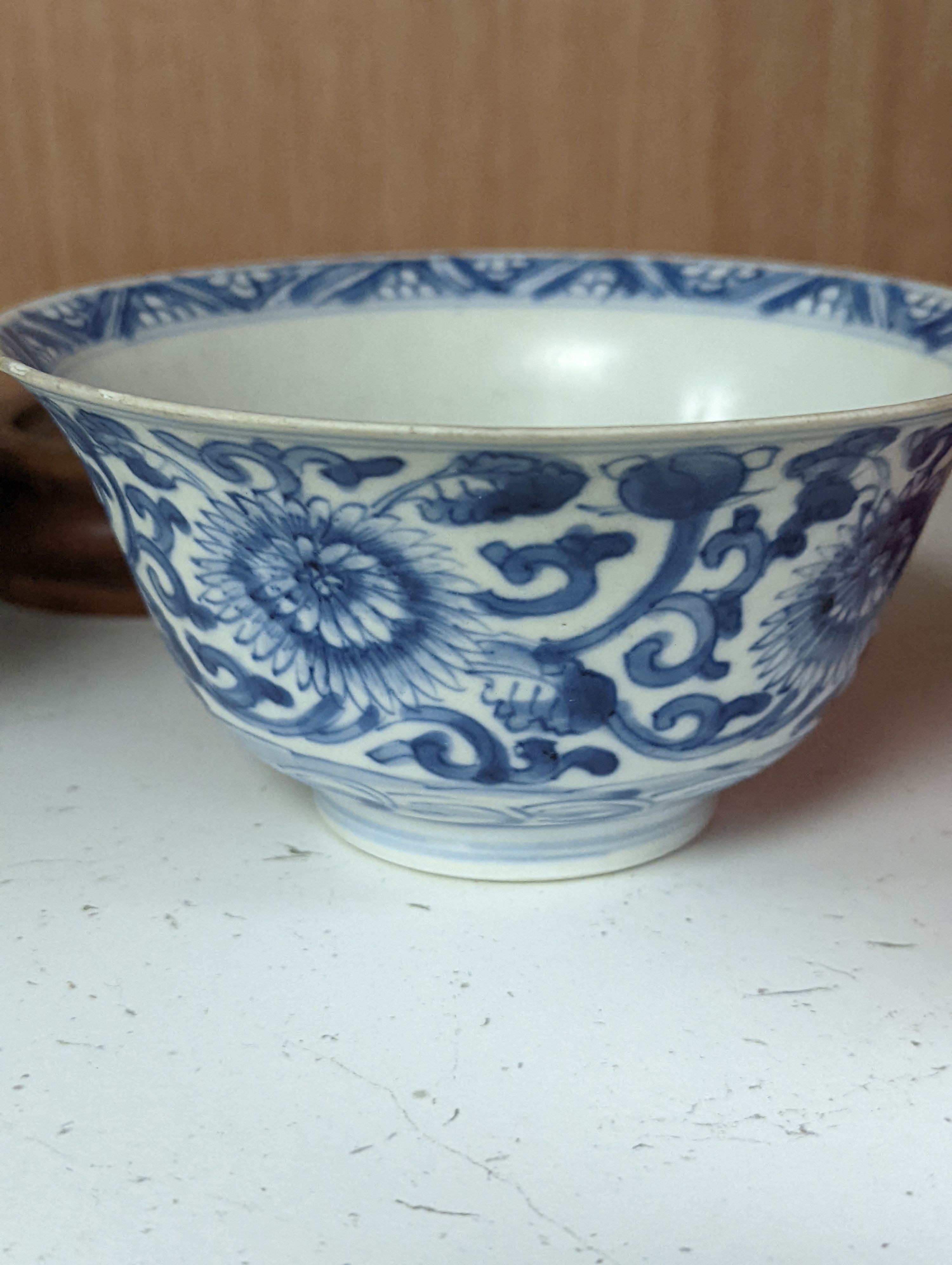 A Chinese blue and white bowl, Kangxi, 15cm. diam., a famille rose teapot stand, Yongzheng, and two doucai bowls